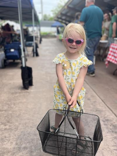A young girl enjoys the market